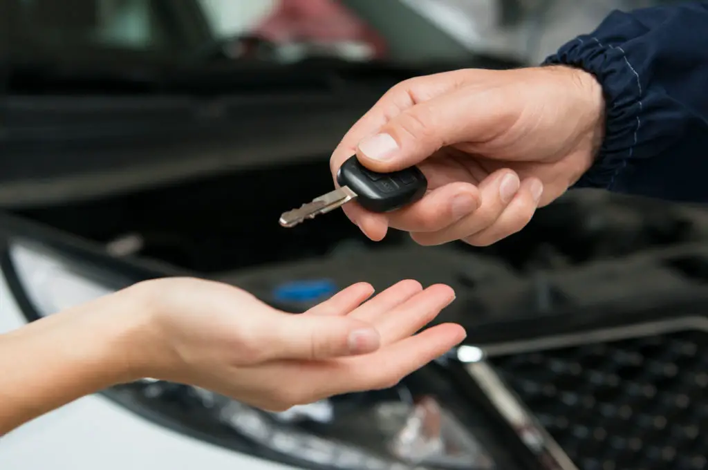 Handing a car key